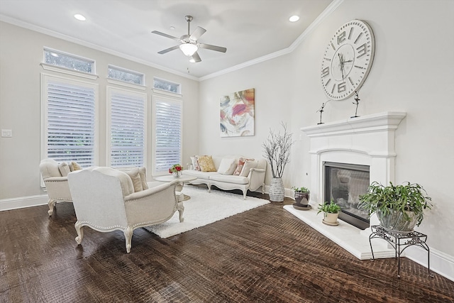 living room featuring crown molding, ceiling fan, and wood-type flooring