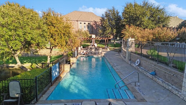 view of swimming pool featuring a patio area and a pergola