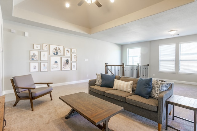 living room with light carpet and ceiling fan