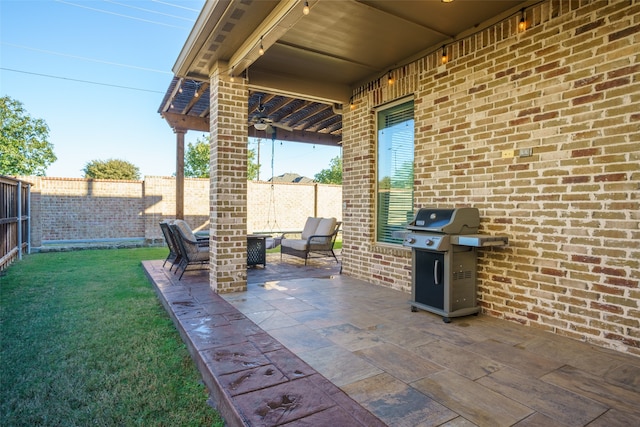 view of patio with a grill