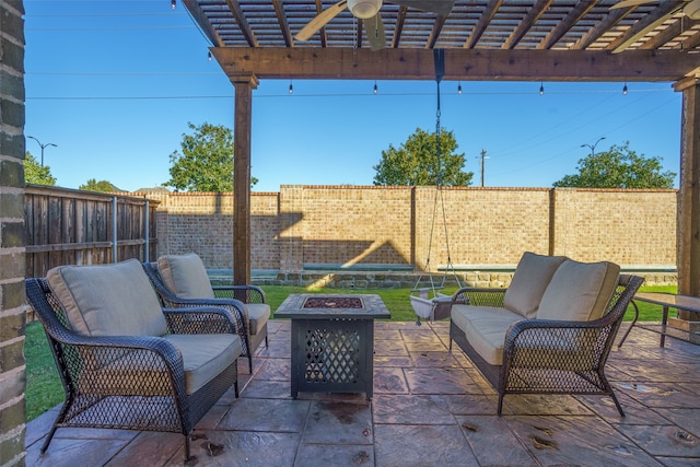 view of patio with a pergola, ceiling fan, and an outdoor living space with a fire pit