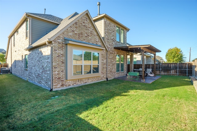 rear view of house with a lawn, a patio area, ceiling fan, and central AC unit