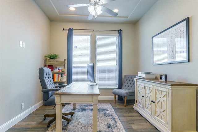 office space featuring ceiling fan and dark wood-type flooring