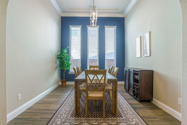 dining area with dark hardwood / wood-style flooring and ornamental molding