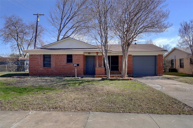 single story home featuring a garage and a front lawn