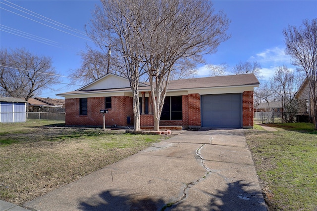 single story home with a garage and a front yard