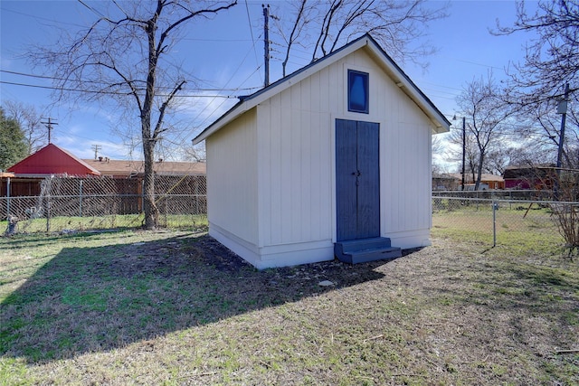 view of outbuilding featuring a yard