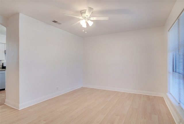 unfurnished room featuring ceiling fan and light wood-type flooring