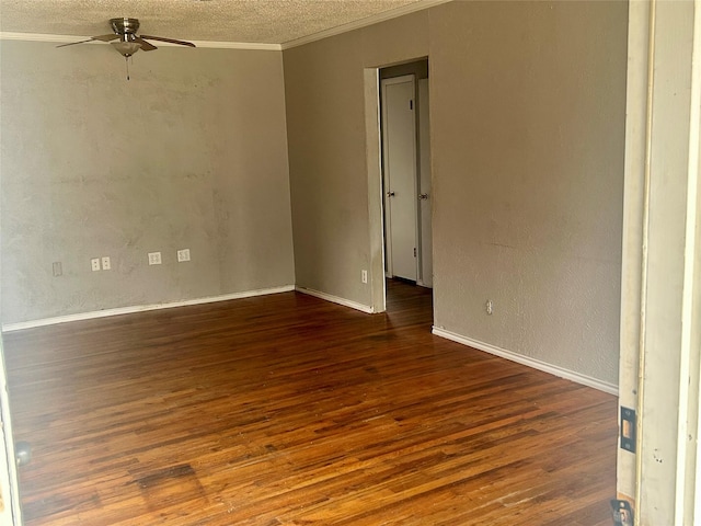 unfurnished room with ornamental molding, a textured ceiling, ceiling fan, and dark wood-type flooring