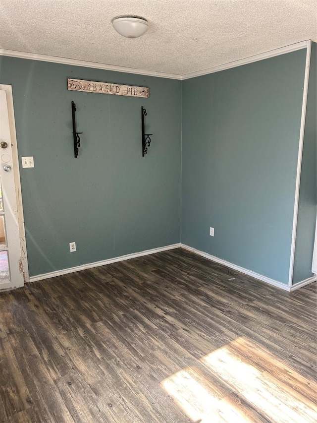 unfurnished room with crown molding, dark hardwood / wood-style flooring, and a textured ceiling