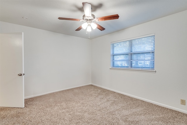 carpeted empty room with ceiling fan