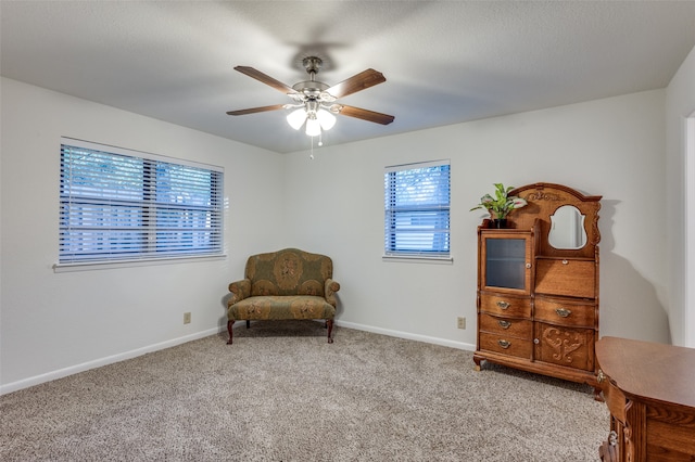 sitting room featuring carpet flooring and ceiling fan