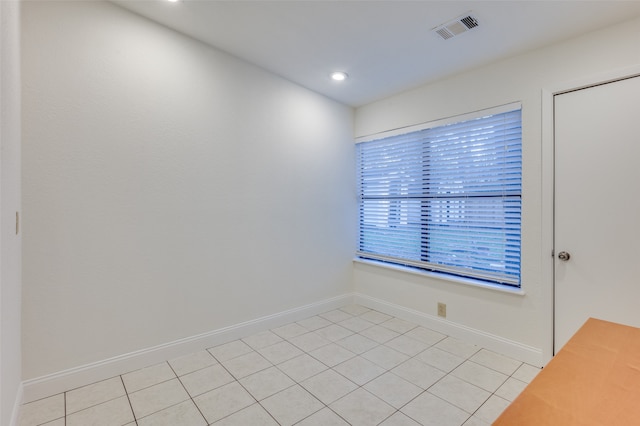 unfurnished room with light tile patterned floors