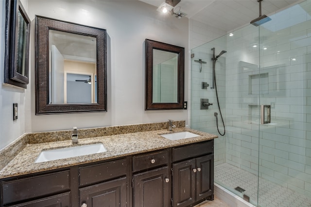 bathroom featuring vanity and a shower with door