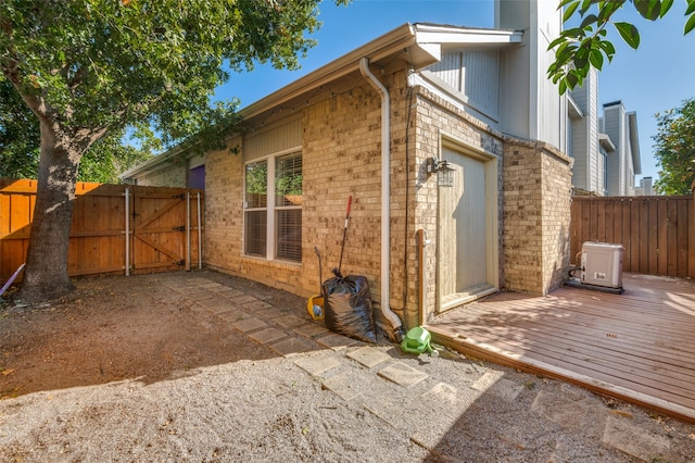 view of property exterior featuring a wooden deck