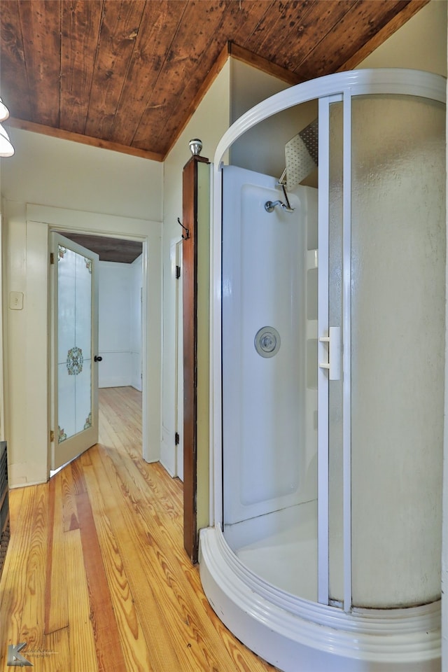 bathroom featuring hardwood / wood-style floors, wooden ceiling, and an enclosed shower