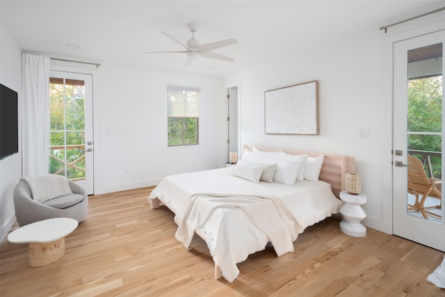 bedroom featuring access to outside, ceiling fan, and light wood-type flooring