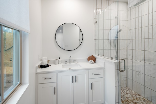 bathroom featuring vanity and walk in shower