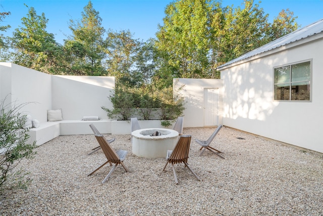 view of yard with an outdoor fire pit and a patio