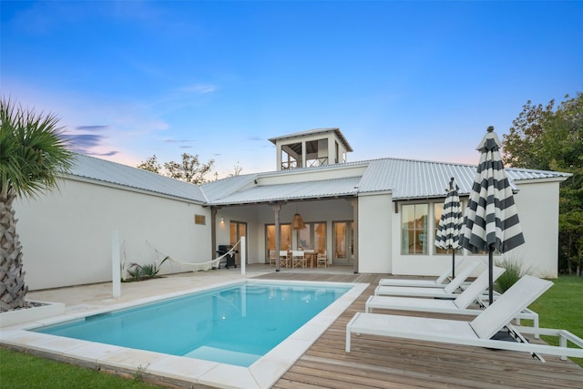 23502 Kate Ln, Arp, TX 75750 - back of house with stucco siding, metal roof, an outdoor pool, and a deck