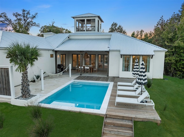 23502 Kate Ln, Arp, TX 75750 - back of property featuring stucco siding, a patio, an outdoor pool, a yard, and metal roof