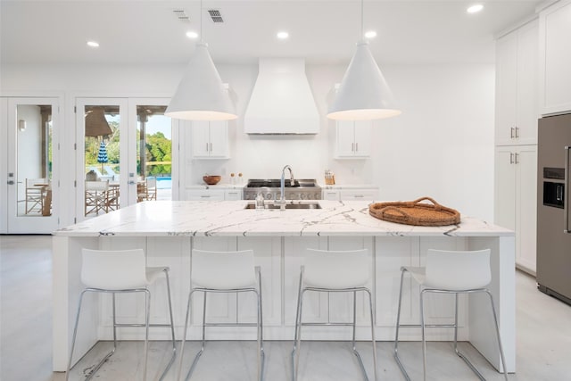 23502 Kate Ln, Arp, TX 75750 - kitchen featuring custom range hood, stainless steel fridge with ice dispenser, a sink, white cabinetry, and recessed lighting