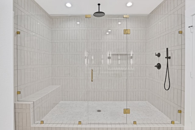 bathroom with a shower with shower door