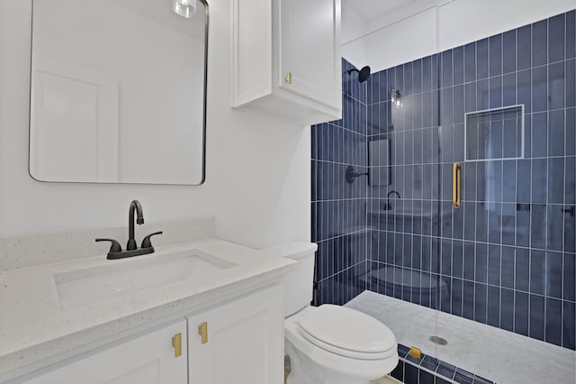 bathroom featuring vanity, toilet, and an enclosed shower