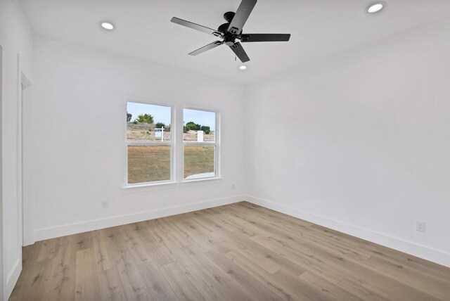 unfurnished room with light hardwood / wood-style flooring and ceiling fan