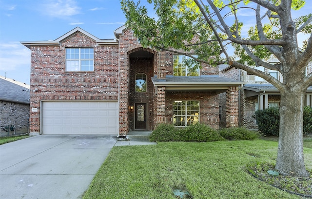 view of front facade with a garage and a front lawn