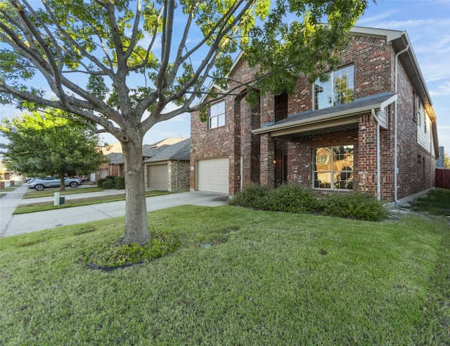 view of front of home with a garage and a front yard