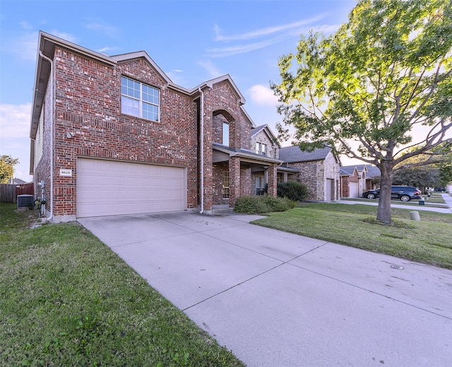 view of front of house with a garage and a front lawn