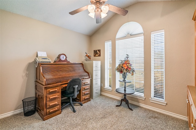 carpeted office featuring ceiling fan and vaulted ceiling