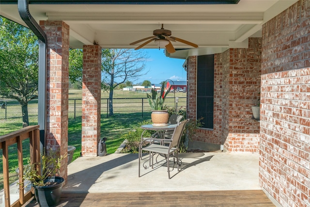 view of patio featuring ceiling fan