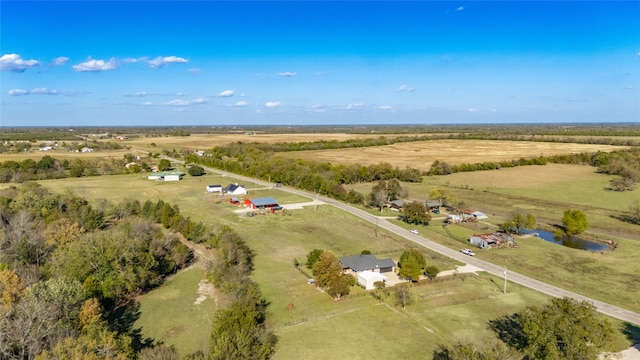 birds eye view of property with a rural view