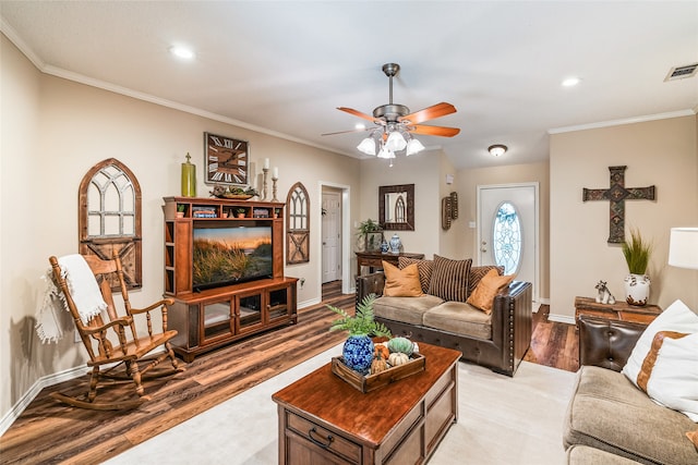 living room featuring ceiling fan, light hardwood / wood-style floors, and ornamental molding