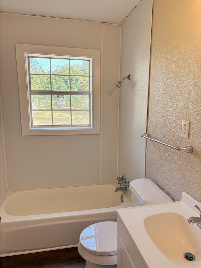 full bathroom with vanity, bathing tub / shower combination, and toilet