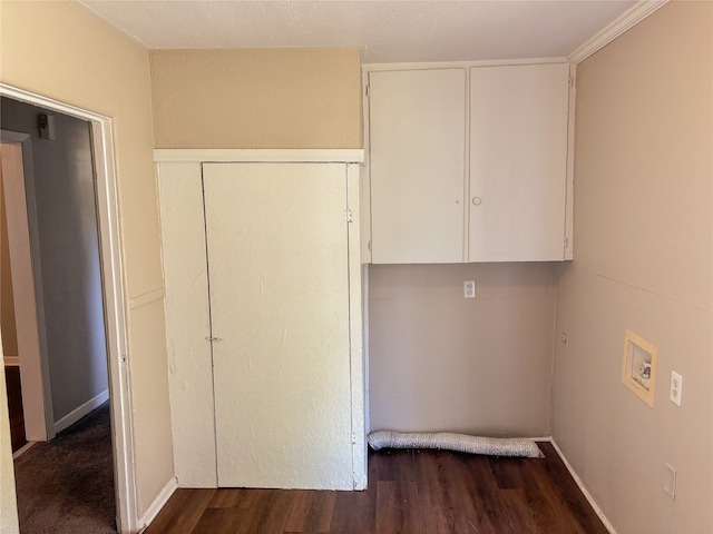 washroom featuring hookup for an electric dryer, dark hardwood / wood-style flooring, cabinets, and hookup for a washing machine