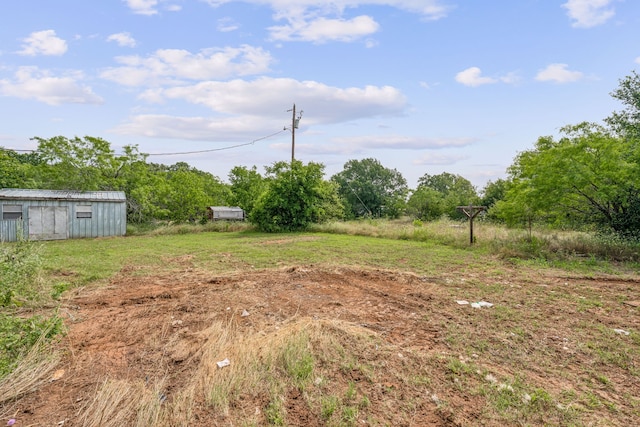 view of yard with a rural view