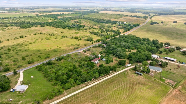 birds eye view of property featuring a rural view