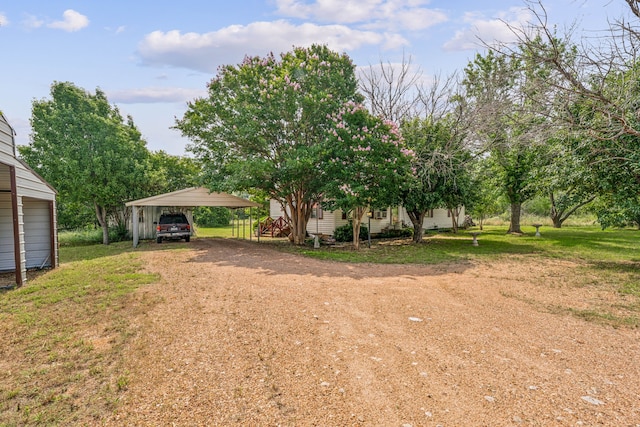 view of yard with a carport