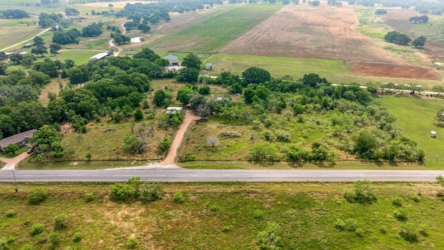 birds eye view of property with a rural view