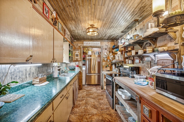 kitchen featuring appliances with stainless steel finishes, wooden walls, wooden ceiling, and sink