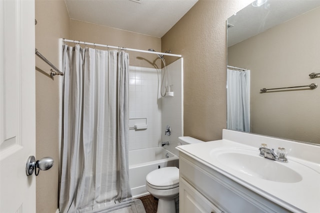 full bathroom with shower / bath combo, toilet, a textured ceiling, and vanity