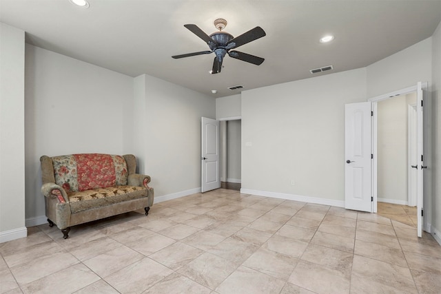 sitting room with ceiling fan