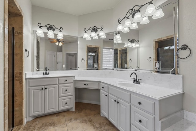 bathroom with ceiling fan, vanity, a shower with shower door, and tile patterned floors