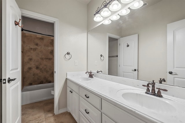 full bathroom featuring tiled shower / bath, vanity, toilet, and tile patterned flooring