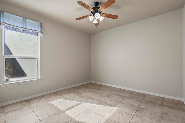 tiled empty room with ceiling fan