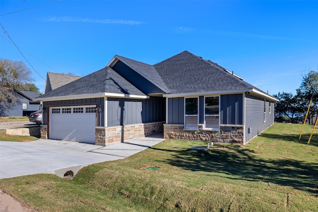 view of front of property featuring a garage and a front lawn