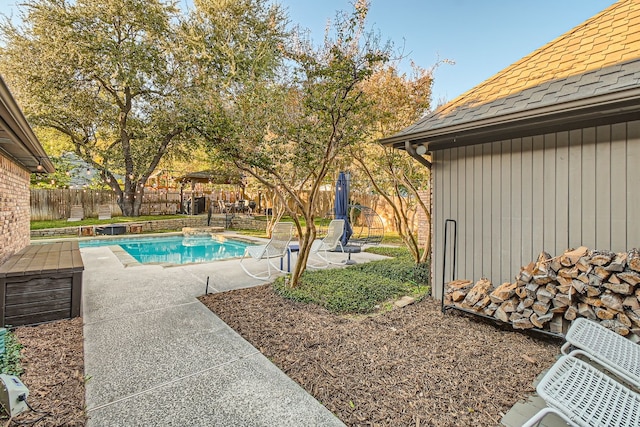 view of swimming pool with a patio